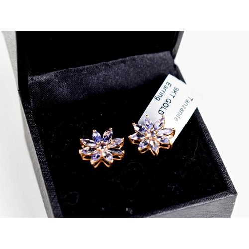 287 - A pair of 9ct gold and tanzanite stud earrings, of flowerhead form, 2.1g.