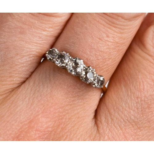 290 - An 18ct gold and diamond five stone ring, the old cut diamonds totalling approximately 0.85cts, size... 