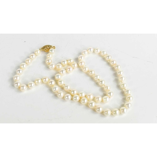 295 - A 14ct gold and cultured pearl necklace, the decoratively pierced clasp in 9ct gold, 42cm long.