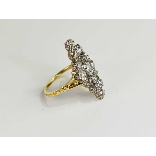 3 - An 18ct gold and diamond ring, the navette form setting composed of old cut diamonds, the central di... 