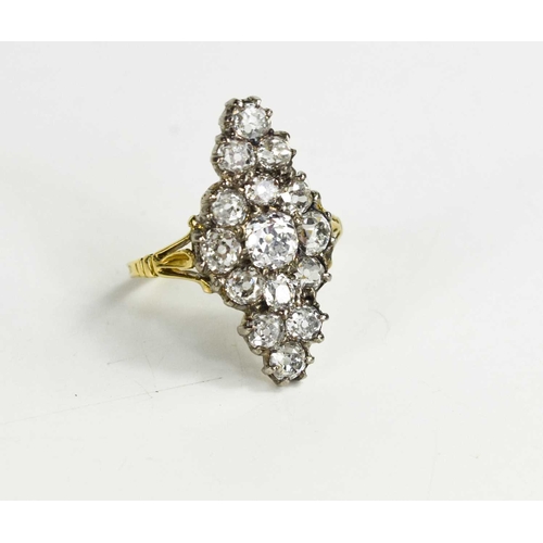 3 - An 18ct gold and diamond ring, the navette form setting composed of old cut diamonds, the central di... 