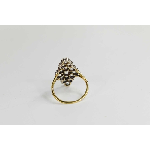 3 - An 18ct gold and diamond ring, the navette form setting composed of old cut diamonds, the central di... 