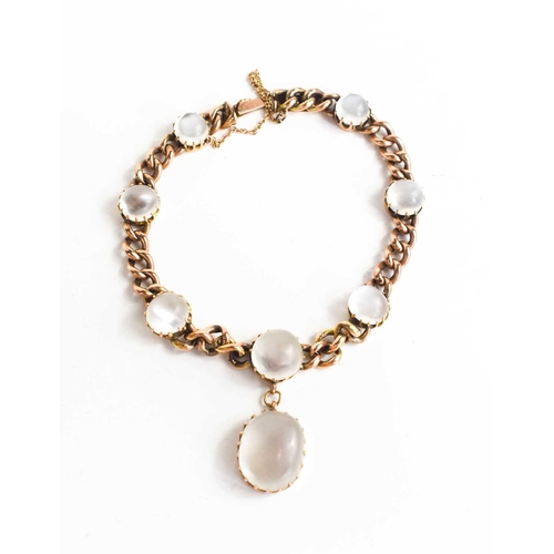 300 - A 9ct gold and moonstone bracelet, the chain link set with seven cabochon moonstones and an oval pen... 