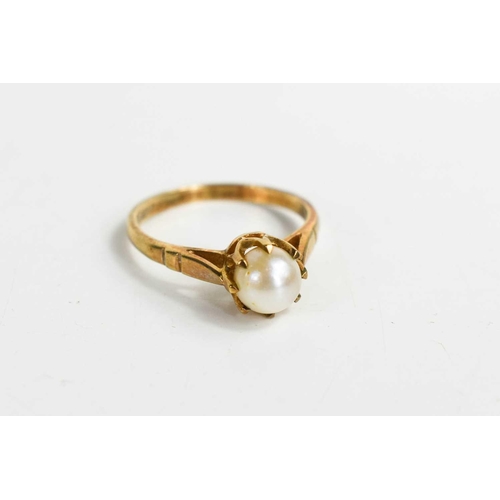 301 - A 9ct gold and pearl ring, the single pearl in an eight claw setting, 2.48g.