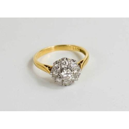 306 - An 18ct gold, diamond and cluster ring, the central diamond approximately 1/8ct, 2.98g.