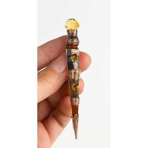 317 - A 9ct rose gold Scottish dirk brooch, set with specimen agates and citrine to the graduated thistles... 