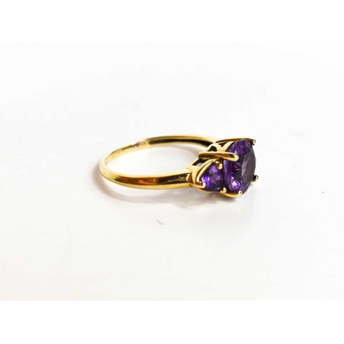 326 - A 9ct gold and amethyst ring, the central brilliant cut amethyst approximately 2½cts, size M, 2.32g.