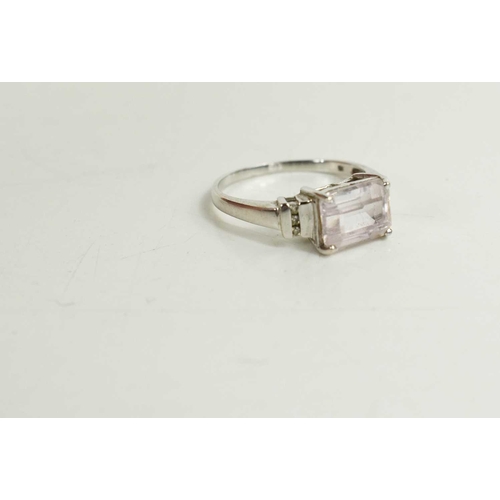 328 - A 9ct white gold and kunzite ring, the rectangular cut kunzite beside three brilliant cut diamonds s... 