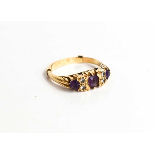 33 - A 9ct gold, amethyst and diamond ring, three brilliant cut amethysts interspersed with diamonds, siz... 