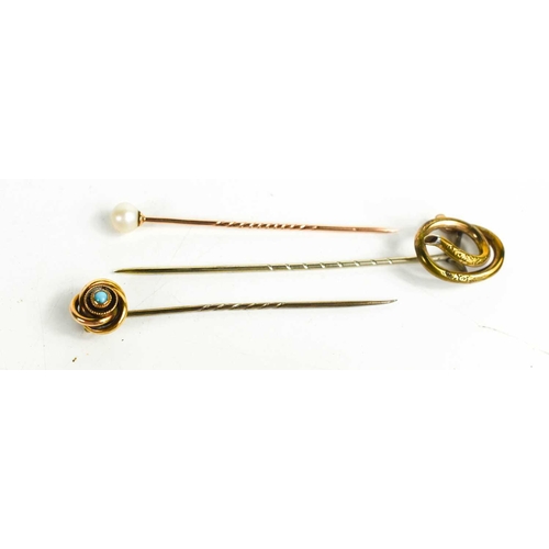 335 - Three antique tie pins, a gold (unmarked, testing as at least 9ct gold) and pearl example, 1.25g, a ... 