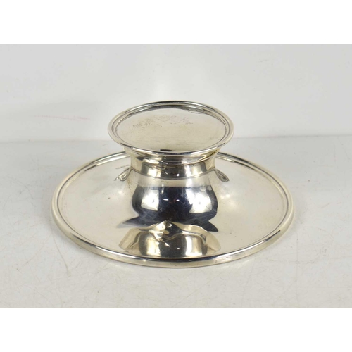 345 - A silver capstan inkwell with clear glass liner, hallmarked for Birmingham 1945.