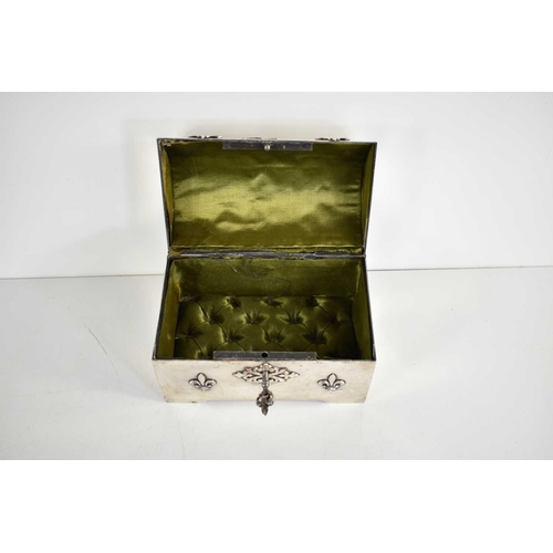 358a - A late 19th century French silver plated casket, silk lined, the casket decorated with the heraldic ... 