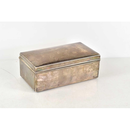 358 - A silver cigarette box of rectangular form, cedar lined, 16cm by 9cm by 7cm high, hallmarks worn.