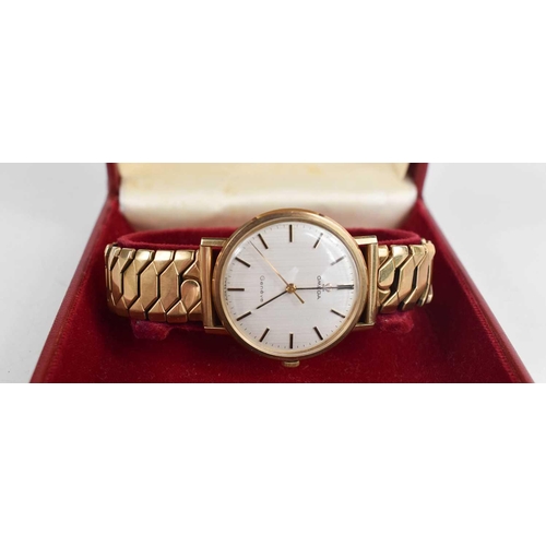 370 - A 9ct gold Omega 'Geneve' gentleman's wristwatch, baton dial, gold plated strap and original box.