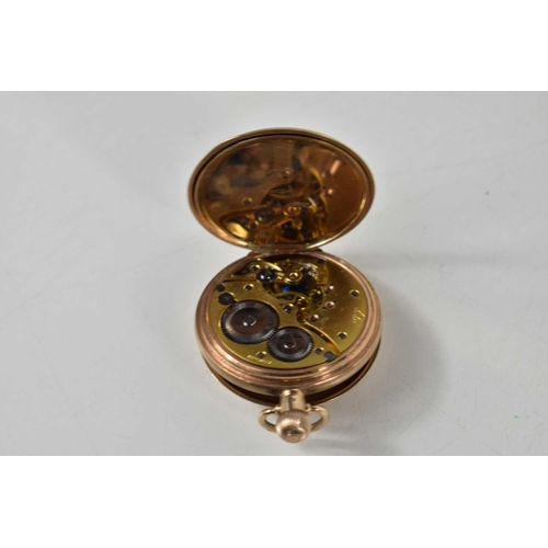 386a - A 9ct gold half hunter pocket watch, white enamel dial with Roman numerals, with subsidiary seconds ... 