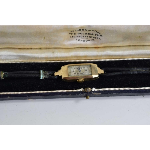 387 - An Art Deco 9ct gold cased ladies wristwatch, Arabic dial, with cord and leather strap and original ... 