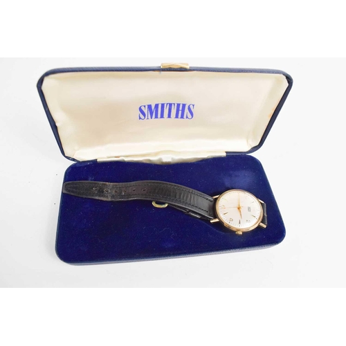 388 - A 9ct gold Smiths Everest wristwatch with numeral and baton dial, black leather strap and the origin... 