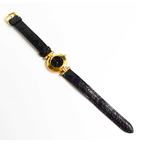 43 - A Must de Cartier 1980s silver gilt wristwatch with the original black leather strap, numbered 59000... 