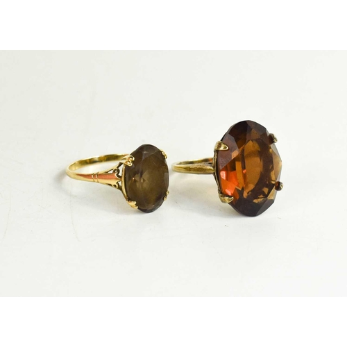 45 - A 9ct gold and smoky quartz ring, the oval cut quartz within double four claw setting, size R, 2.57g... 