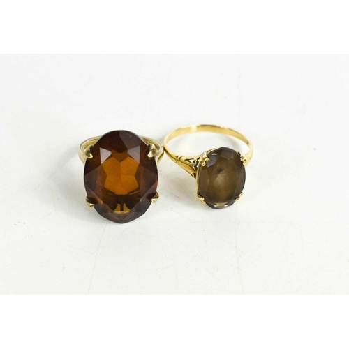 45 - A 9ct gold and smoky quartz ring, the oval cut quartz within double four claw setting, size R, 2.57g... 