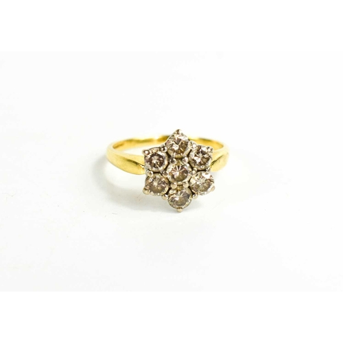 56 - An 18ct yellow gold and diamond flowerhead ring, each of the five diamonds approximately ¼ct each, s... 