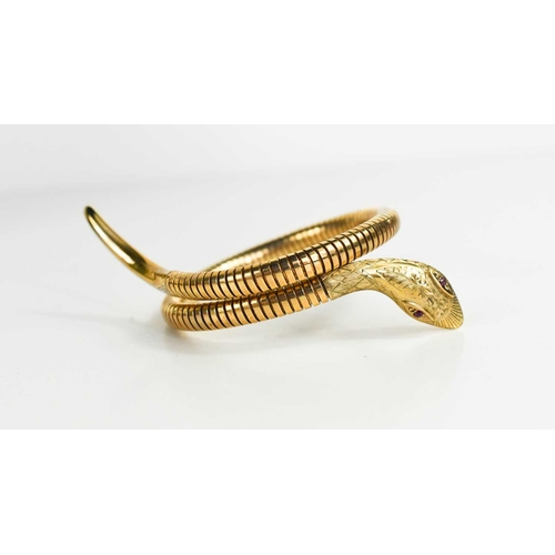 6 - A 9ct gold snake form bracelet, set with ruby eyes, and composed of articulated links terminating wi... 