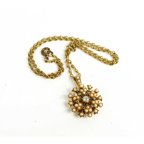 64 - A 15ct gold rope twist necklace, with diamond and seed pearl set pendant in the form of a snowflake ... 