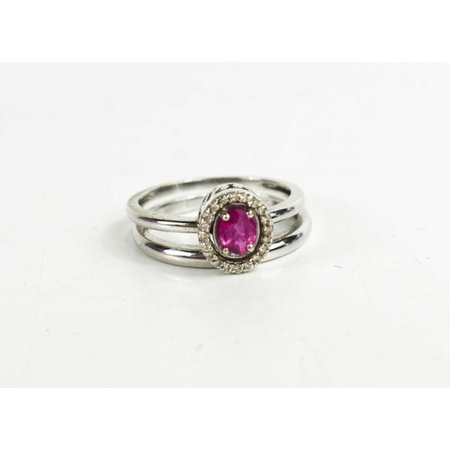 66 - A 14ct gold, diamond and ruby twin ring, can be worn as a single oval cut ruby or with the diamond b... 