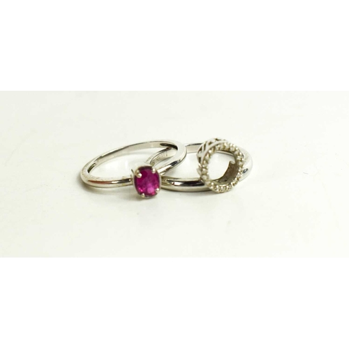 66 - A 14ct gold, diamond and ruby twin ring, can be worn as a single oval cut ruby or with the diamond b... 