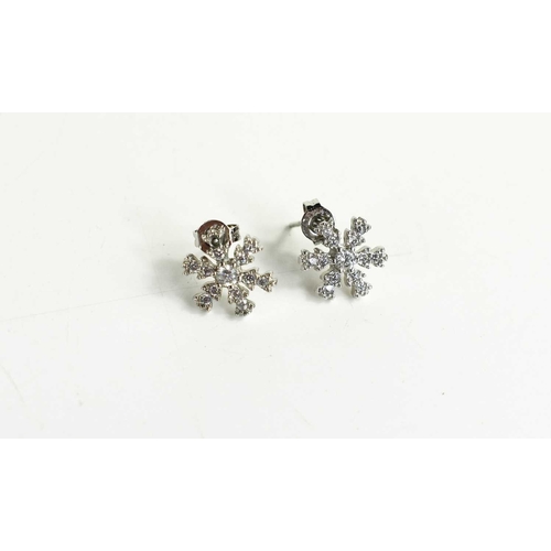 71 - A 9ct white gold and diamond snowflake form stud earrings, with butterfly backs, 1.19g.