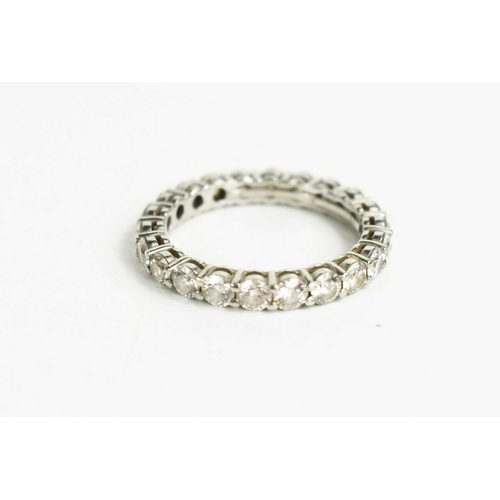 80 - A Tiffany & Co platinum and diamond full eternity ring, set with twenty one brilliant cut diamonds a... 