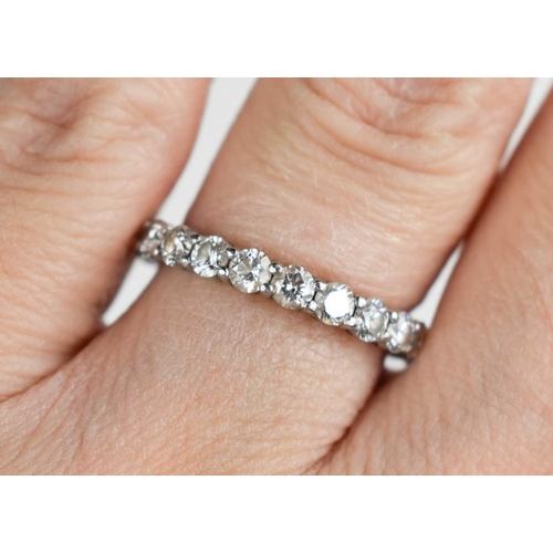 80 - A Tiffany & Co platinum and diamond full eternity ring, set with twenty one brilliant cut diamonds a... 