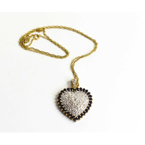 87 - A 9ct gold, diamond and sapphire set heart form pendant necklace, on a 9ct gold chain, 12g.