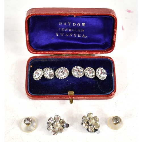 92 - A set of six Edwardian paste buttons in the original box together with a pair of clip on earrings an... 