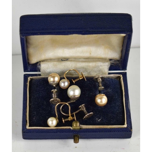 98 - A pair of 9ct gold and pearl screw back earrings, 1g, together with other pearl earrings.