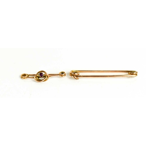 99 - A 9ct gold and ruby set tie pin 1.4g, and a gold plated tie pin.