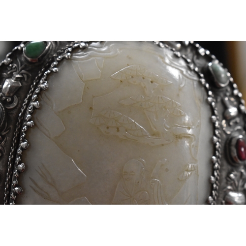 26 - A Qing Dynasty (1644-1912) Chinese white metal and jade hand mirror, comprising a large openwork bel... 