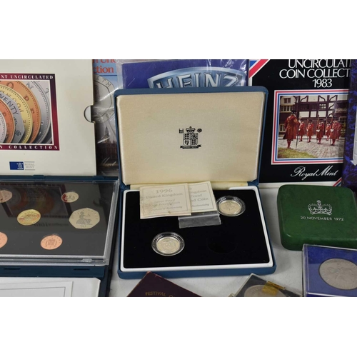 106 - A quantity of GB commemorative coins to include a Royal Mint 1991 and 1996 proof coin set, silver pr... 