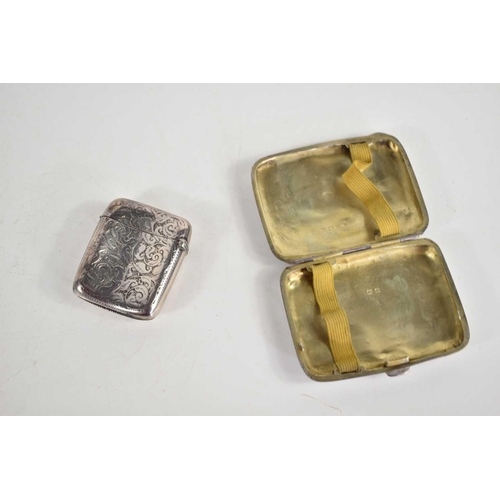 12 - A Victorian silver vesta case together with a silver cigarette case, 3.1toz.