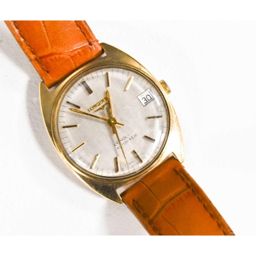 126 - A Longines Conquest Automatic gold cased wristwatch, silvered dial and batons, with tan leather stra... 