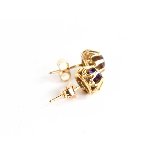 143 - A pair of 9ct gold and amethyst stud earrings, 1.6g.