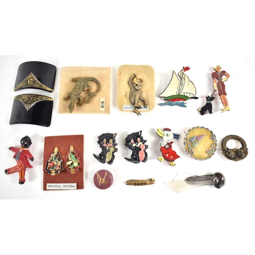 145 - A group of vintage jewellery to include Bakelite brooches of a lady walking her dog, a cartoon duck ... 