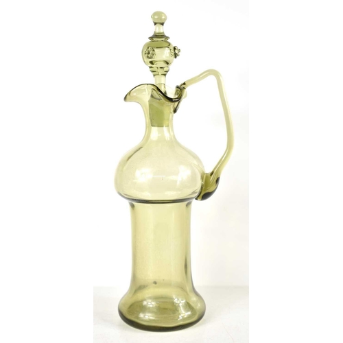 175 - A late 19th century German olive green decanter, hand blown with ruffle rim, the stopper having apll... 