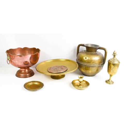 181 - A selection of copper and brass to include chamber stick circa 1880, a brass comport with embossed c... 