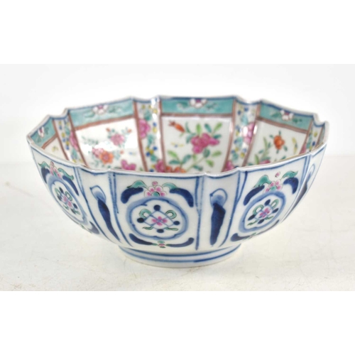 191 - An Oriental bowl decorated with panels of flowers, cut rim with flower basket cartouche, 17.5cm wide... 