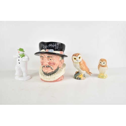 192 - A Royal Doulton Beefeater character jug, D6206, together two Beswick owls and a First Edition Coalpo... 