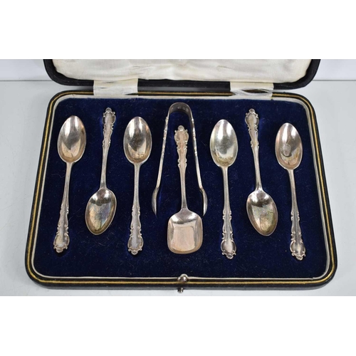 21 - A cased set of six silver tea spoons, sugar tongs and sugar scoop, hallmarked for David Landsborough... 