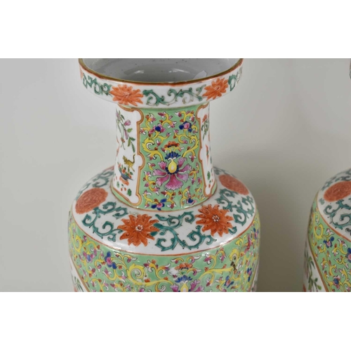 256 - A pair of early 20th century Chinese vases, decorated with flowers, bats and insects, 35cm high.