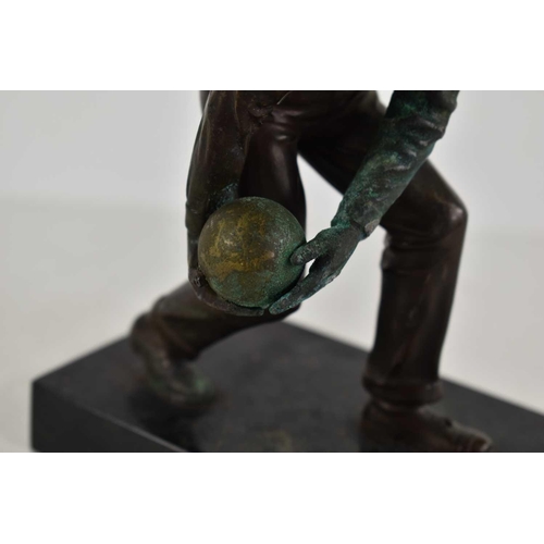 257 - An Art Deco bronze sculpture of a man bowling in the style of Schmidt Hofer, raised on a marble base... 