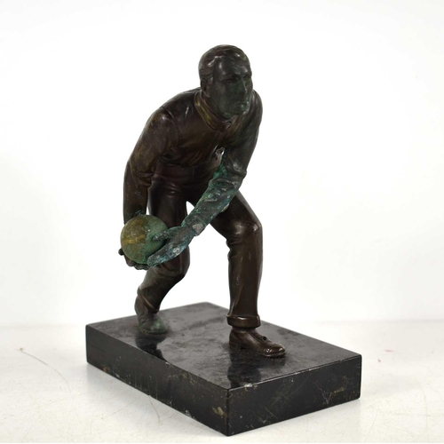 257 - An Art Deco bronze sculpture of a man bowling in the style of Schmidt Hofer, raised on a marble base... 